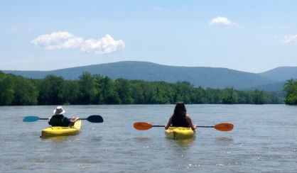 man and woman enjoying the peaceful, calm water and serene view Downriver Canoe Company Shenandoah Valley River